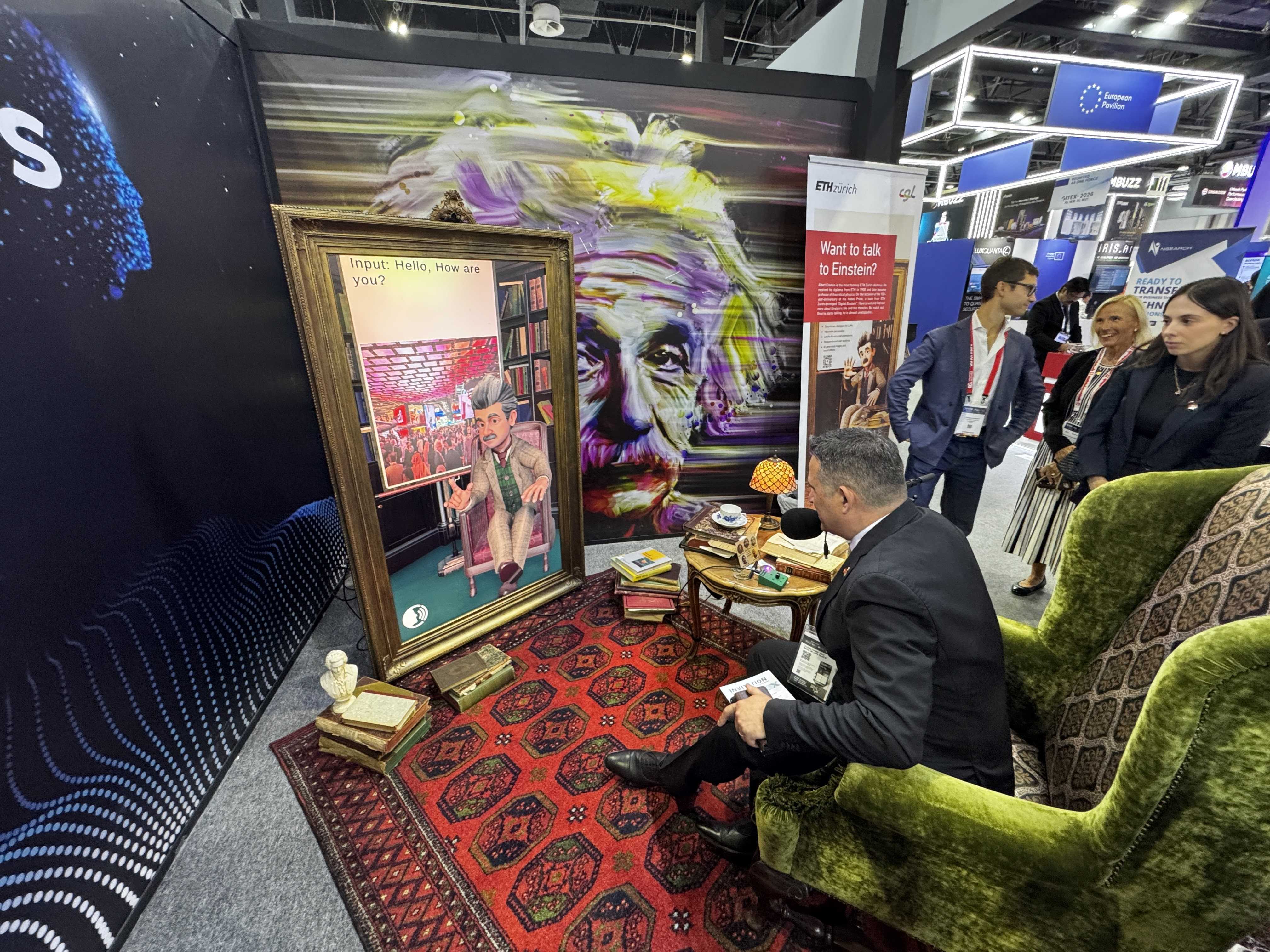 Swiss Ambassador to the UAE, Arthur Mattli, interacting with Digital Einstein at GITEX Global in Dubai.